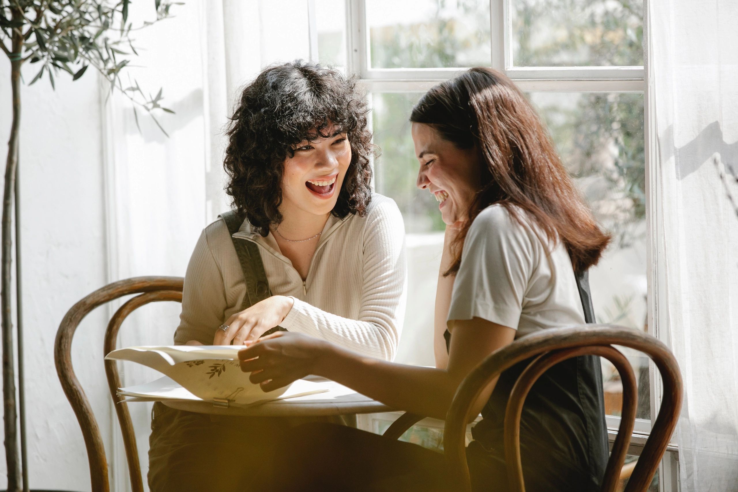 Two women laughing together